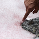 Biagio Di Mauro points to the pink snow on July 4, 2020, on the top of the Presena Glacier near Pellizzano.